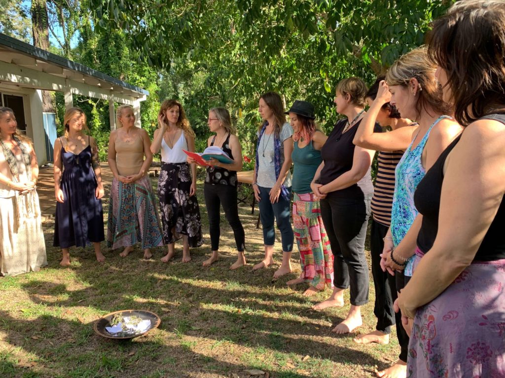 Tami Lynn Kent giving a presentation about women's health and pelvic care to a group of listeners at Level II: The Energetics of Creativity Workshop