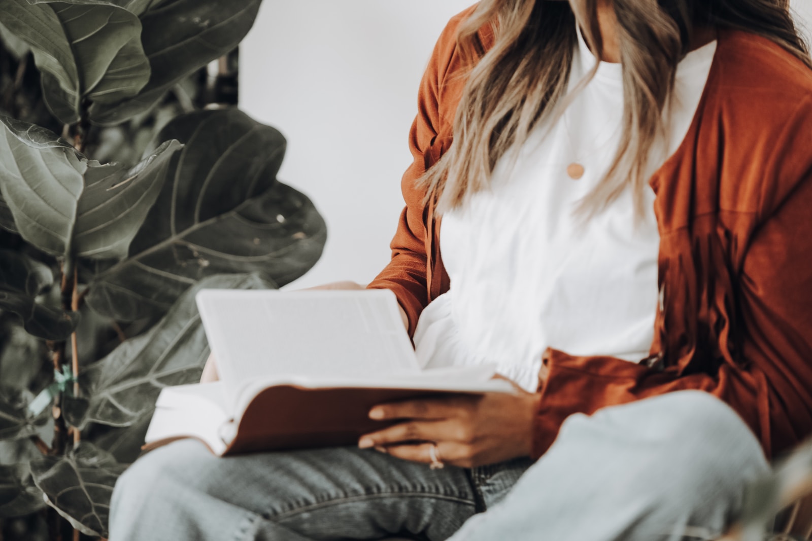 Close-up of woman reading Tami Lynn Kent's published books on women's health, creativity, and pelvic care